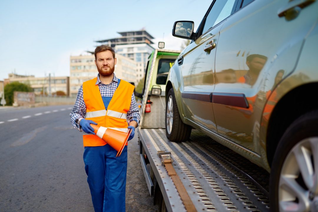 road-worker-putting-traffic-cone-on-roadside